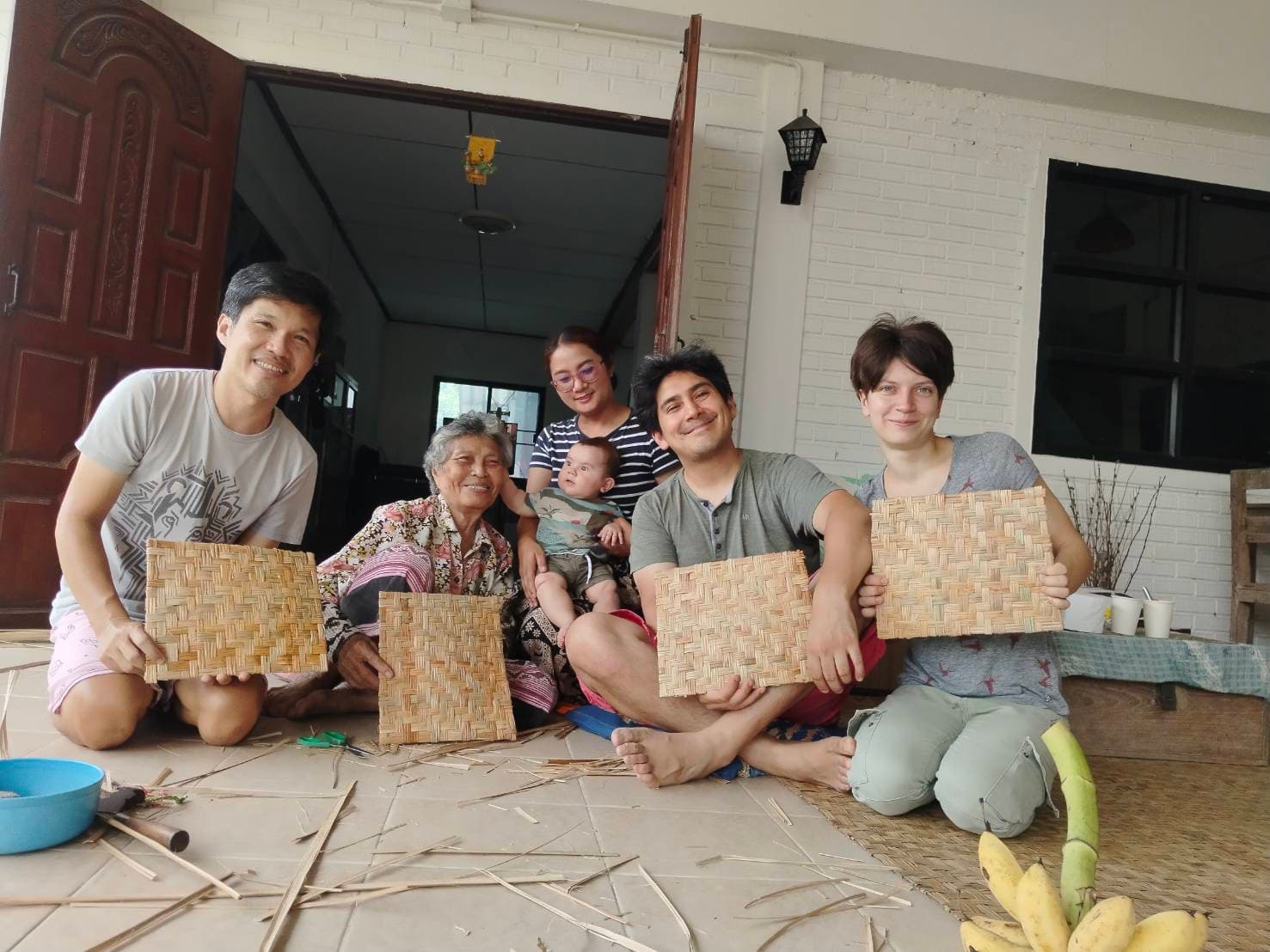 Guests learning Saad Yaeng weaving with local elders